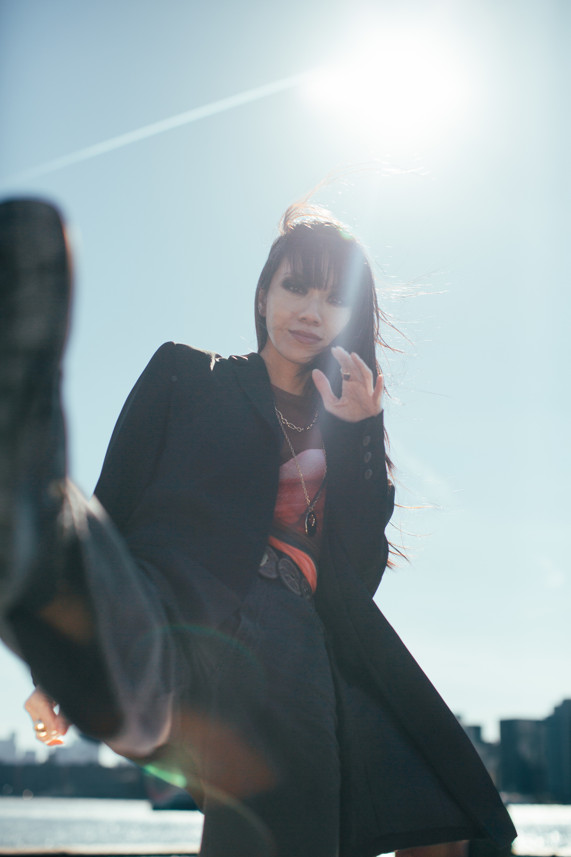 Darin dynamic fashion editorial kick pose NYC skyline