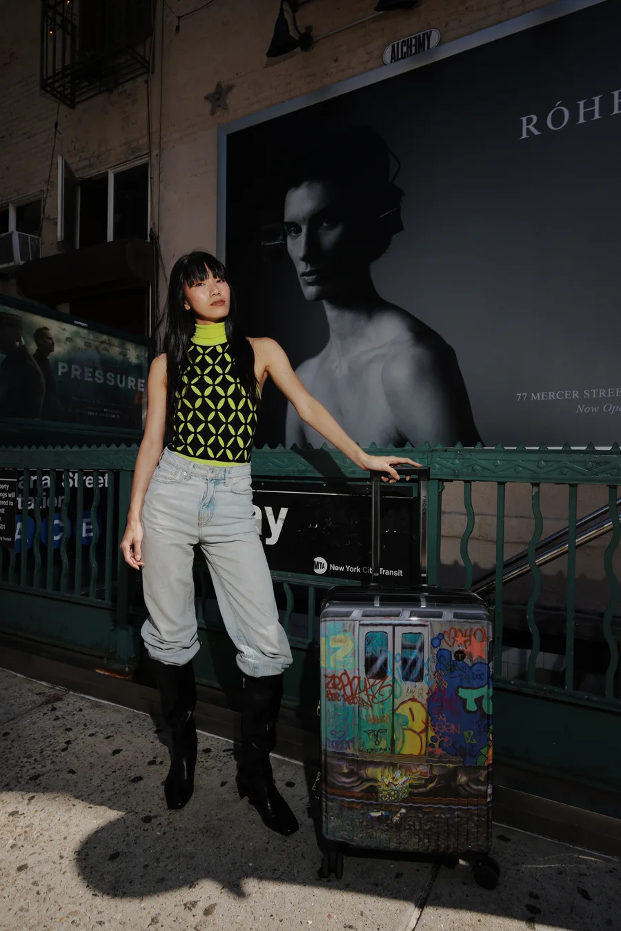 Darin Apinya modeling for Trochi luggage at a New York City subway entrance